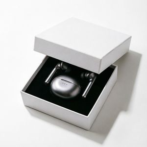 Qwen Image 2 output for the prompt: Minimalist tech packaging: a matte white box slightly open revealing wireless earbuds, clean e-commerce background