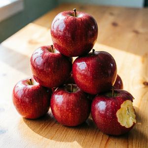Qwen Image 2 output for the prompt: Exactly 7 red apples arranged in a pyramid on a wooden table, one apple with a bite taken out of it on the right side