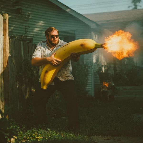 replace the man's assault rifle for a giant banana