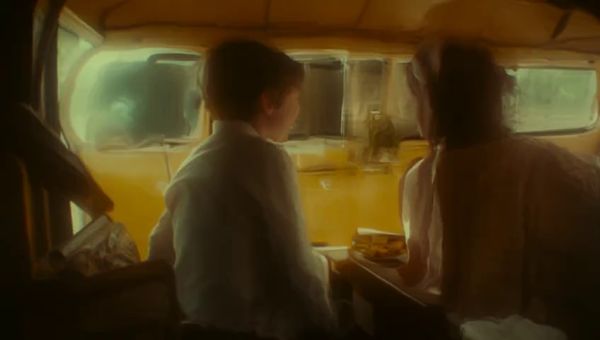 Mochi output for the prompt: Super 16mm film grain, Kodachrome color: a family of four having a picnic in a yellow VW bus parked by a redwood forest. Children laughing, mom pouring lemonade.