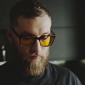 add yellow glasses to the man