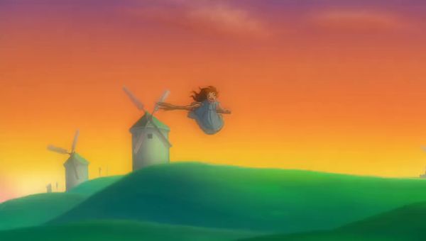 Mochi output for the prompt: Studio Ghibli style hand-drawn animation: a young girl flying on a broom over rolling green hills with windmills at sunset, hair blowing in the wind.