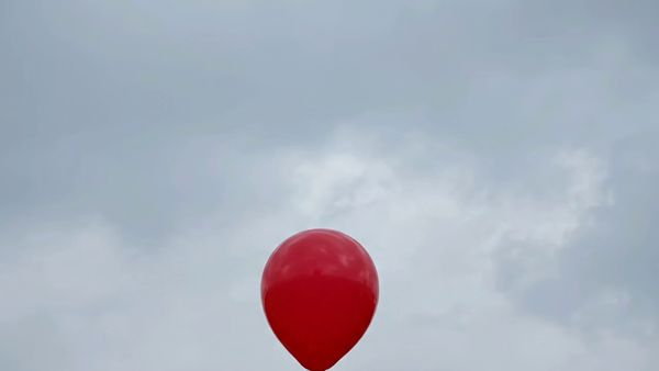 Google Veo 3.1 Lite output for the prompt: A single red balloon rises slowly against a plain overcast grey sky. Nothing else in the frame. 4 seconds.
